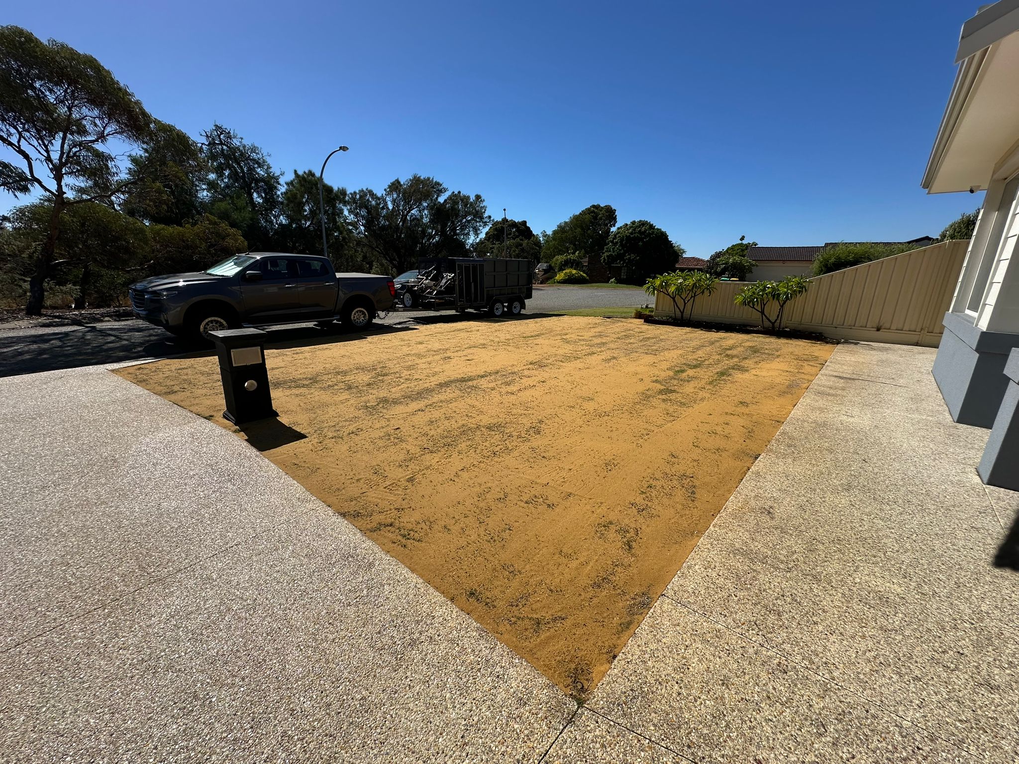 Large front lawn graded and top dressed, ready to grow back in